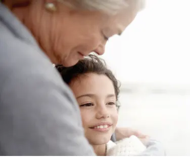 A close-up of a warm embrace between two individuals
